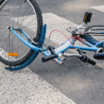 Blue,Child's,Bicycle,Lying,On,A,Pedestrian,Crossing,After,A