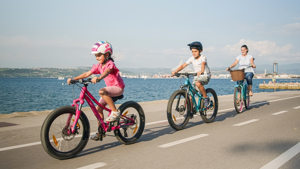 Mother,With,Son,And,Little,Daughter,Relaxed,Cycling,On,A