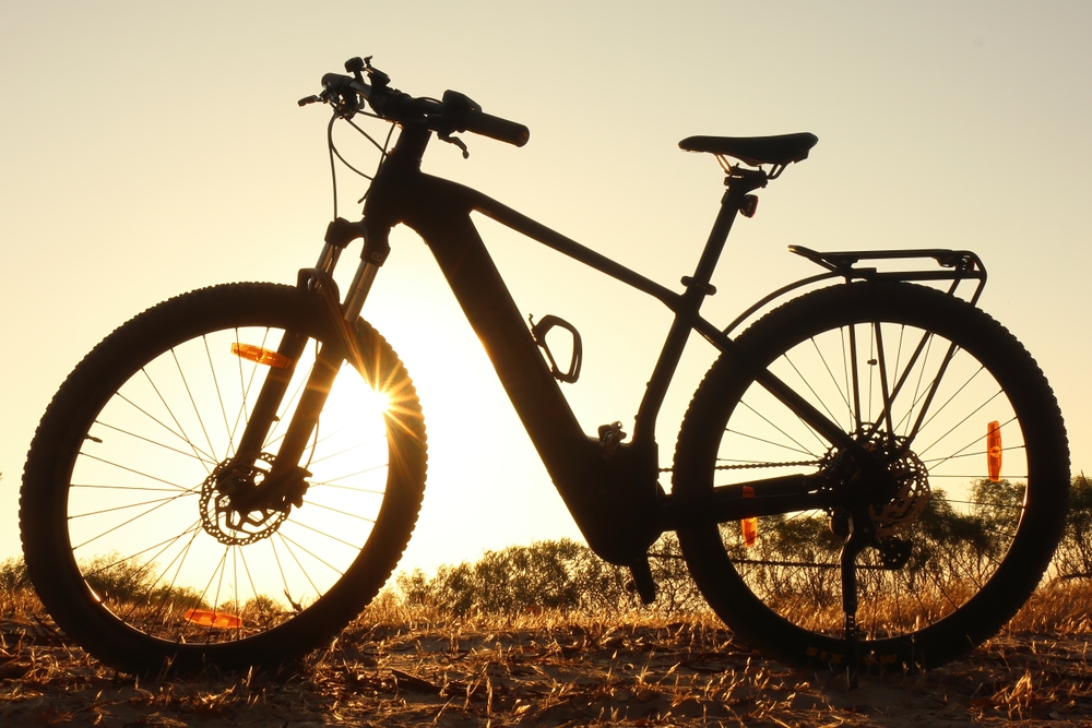 Backlit,Ebike,In,Silhouette,At,Sunset
