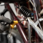 Cropped,Shot,Of,Man,Mechanic,Working,In,Bicycle,Repair,Shop,