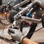 Cropped,Shot,Of,Male,Mechanic,Working,In,Bicycle,Repair,Shop,